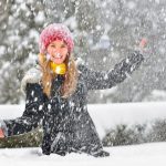 Girl Playing In The Snow