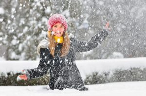 Girl Playing In The Snow